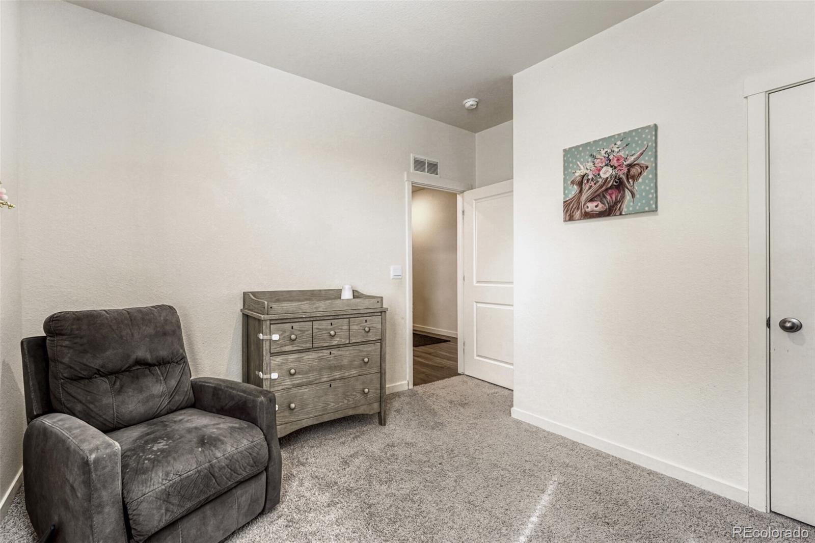 166 Racer Street Bennett, CO 80102 - Photo 31 of 44 a livingroom with furniture and a couch