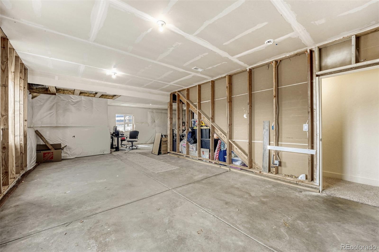 166 Racer Street Bennett, CO 80102 - Photo 35 of 44 a view of an empty room with stairs