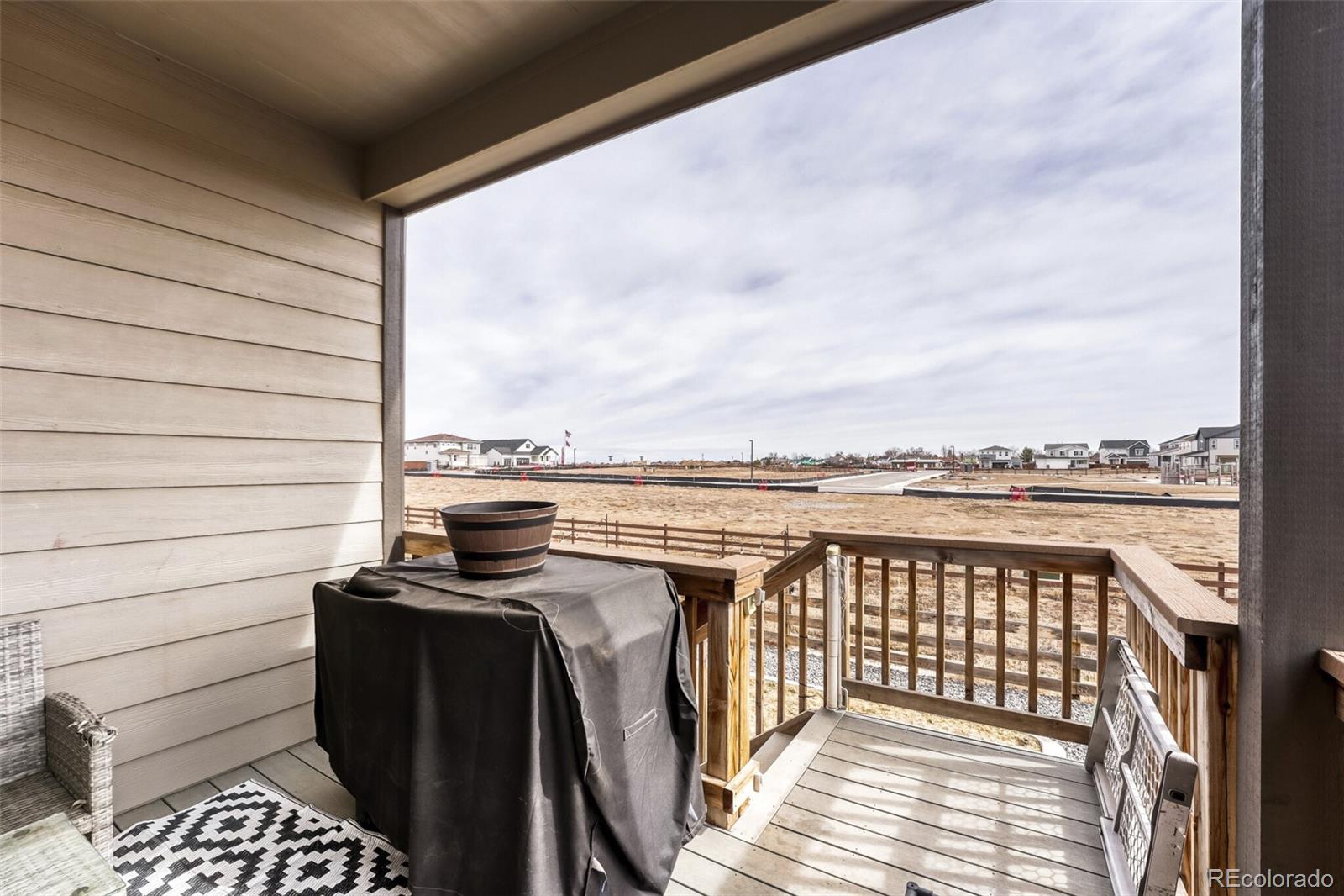 166 Racer Street Bennett, CO 80102 - Photo 39 of 44 a view of a balcony with furniture