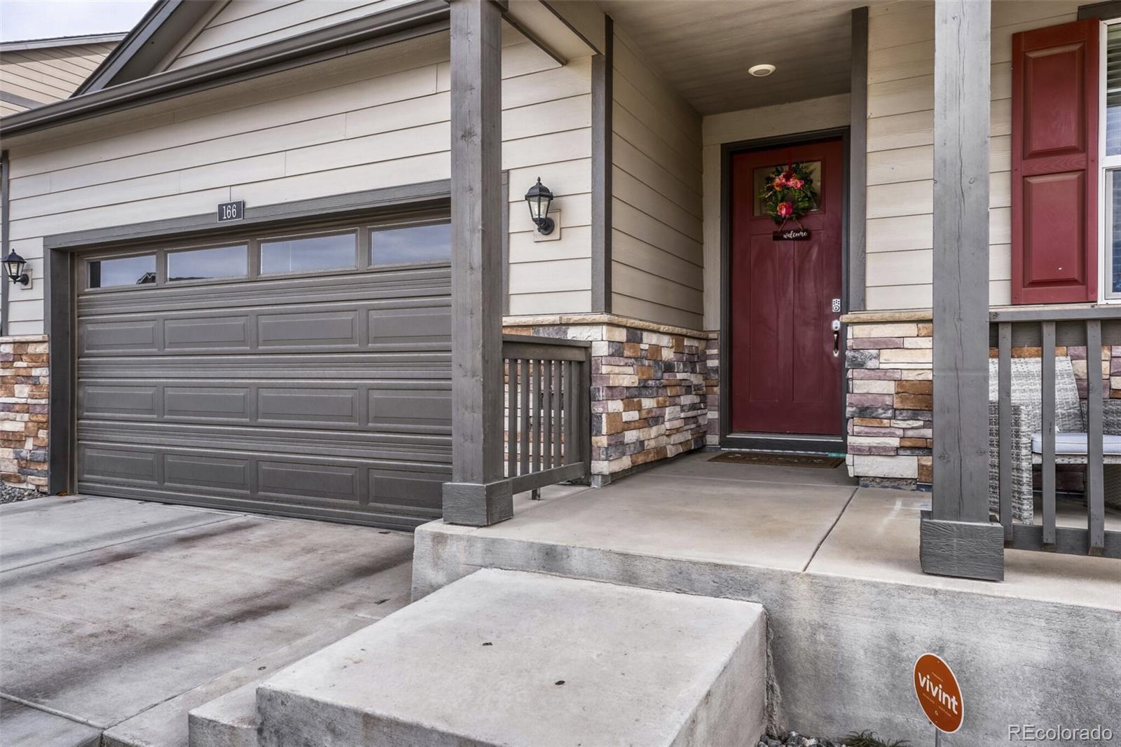 166 Racer Street Bennett, CO 80102 - Photo 4 of 44 a view of a house with a patio