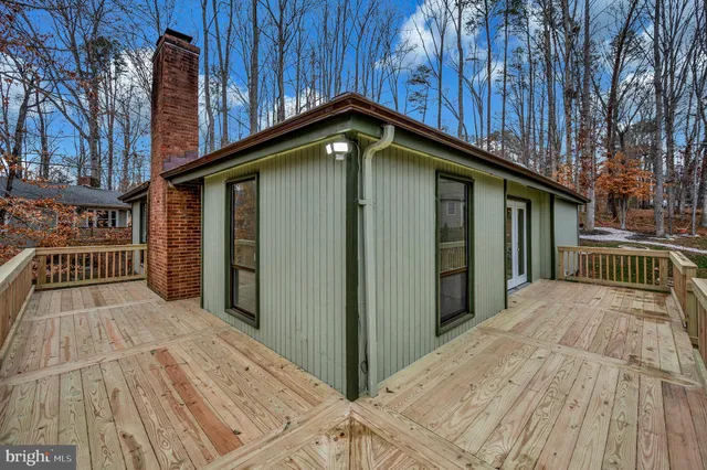 a view of a house with wooden stairs