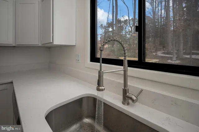 a kitchen with a sink and cabinets