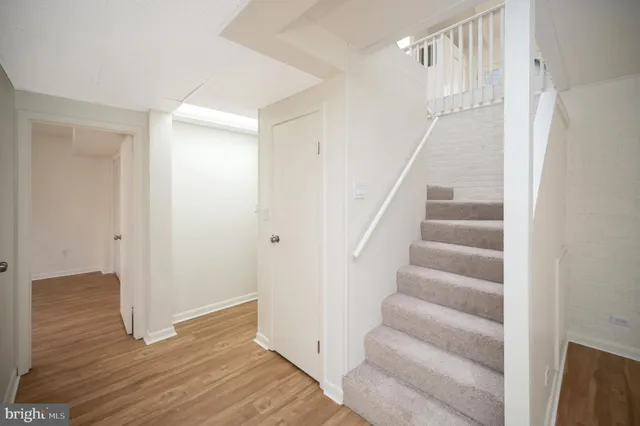 a view of an entryway with wooden floor
