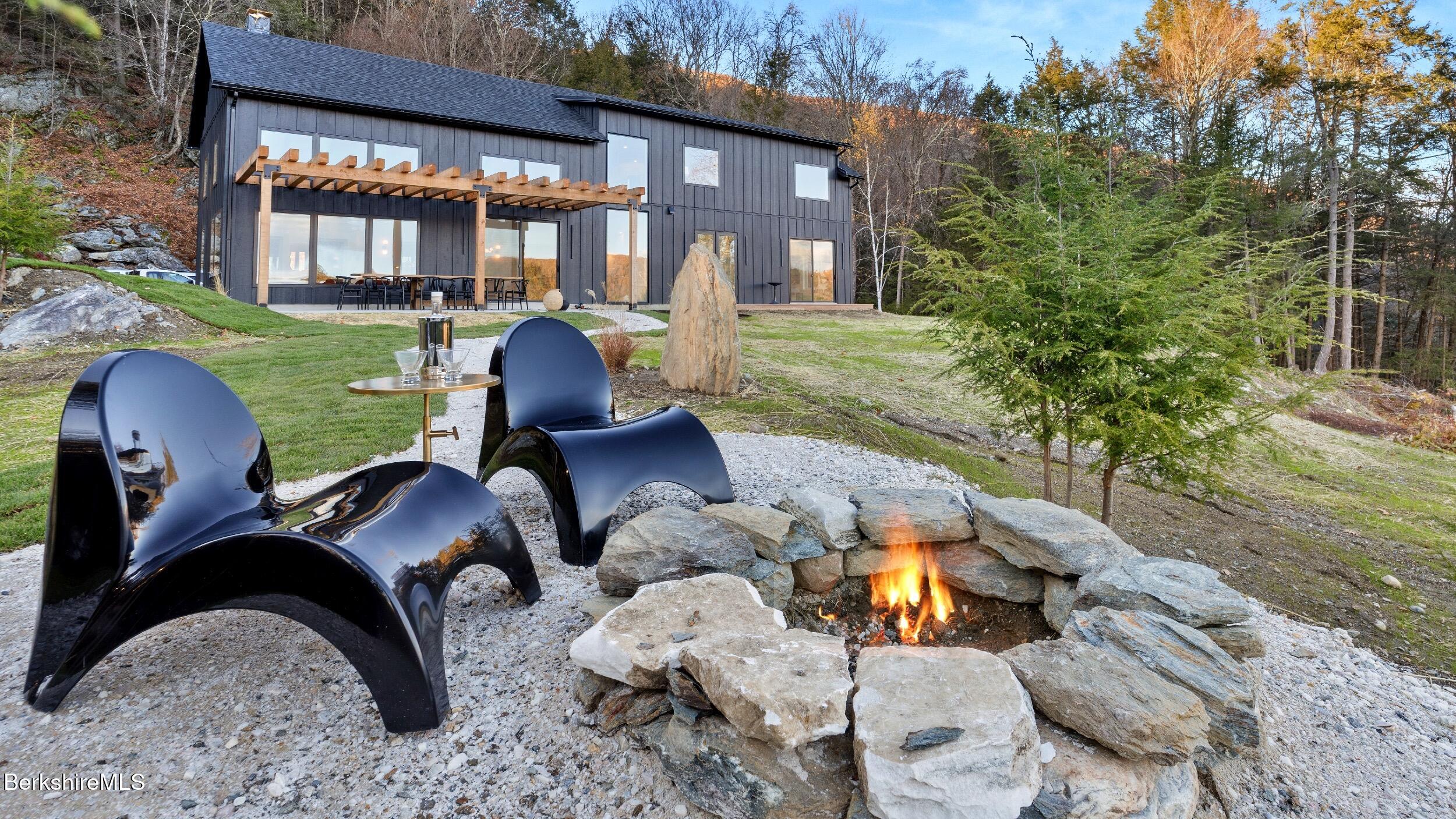 40 East Alford Road West Stockbridge, MA 01266 - Photo 18 of 51 a front view of house with outdoor seating yard and barbeque oven