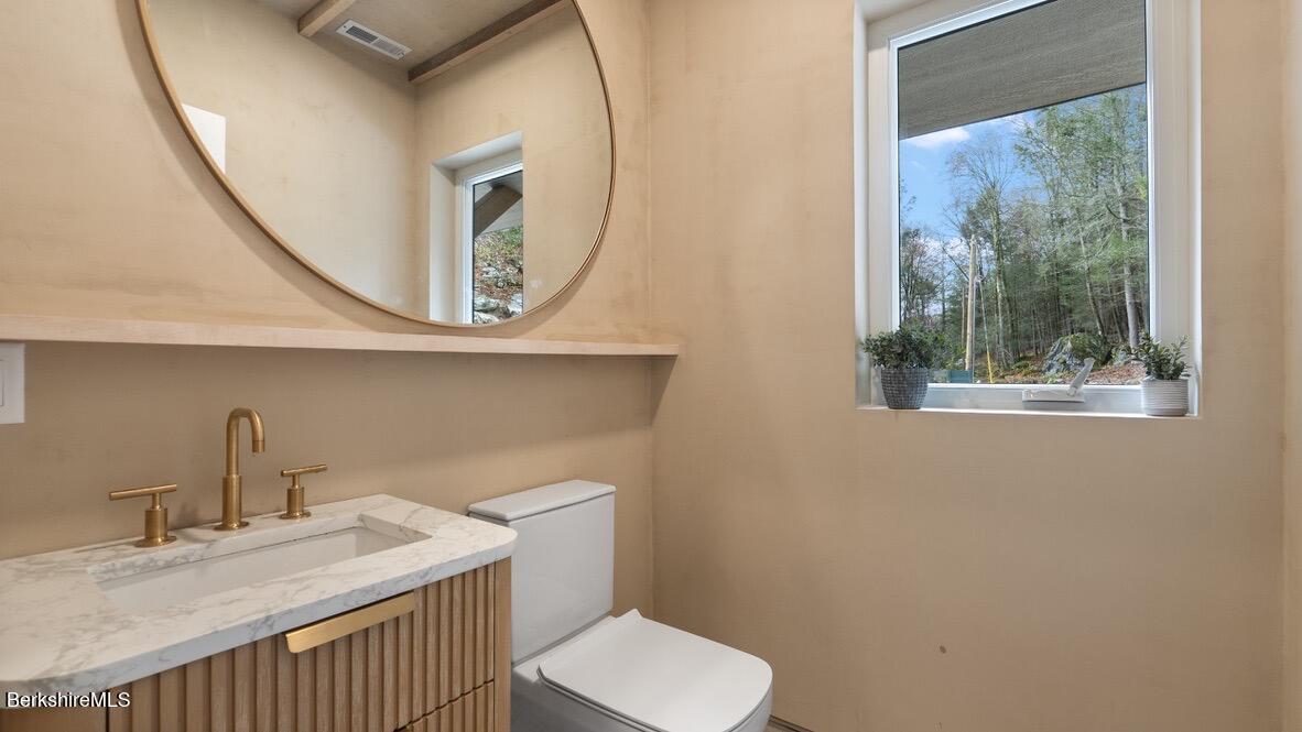 40 East Alford Road West Stockbridge, MA 01266 - Photo 24 of 51 a bathroom with a toilet a sink and a mirror