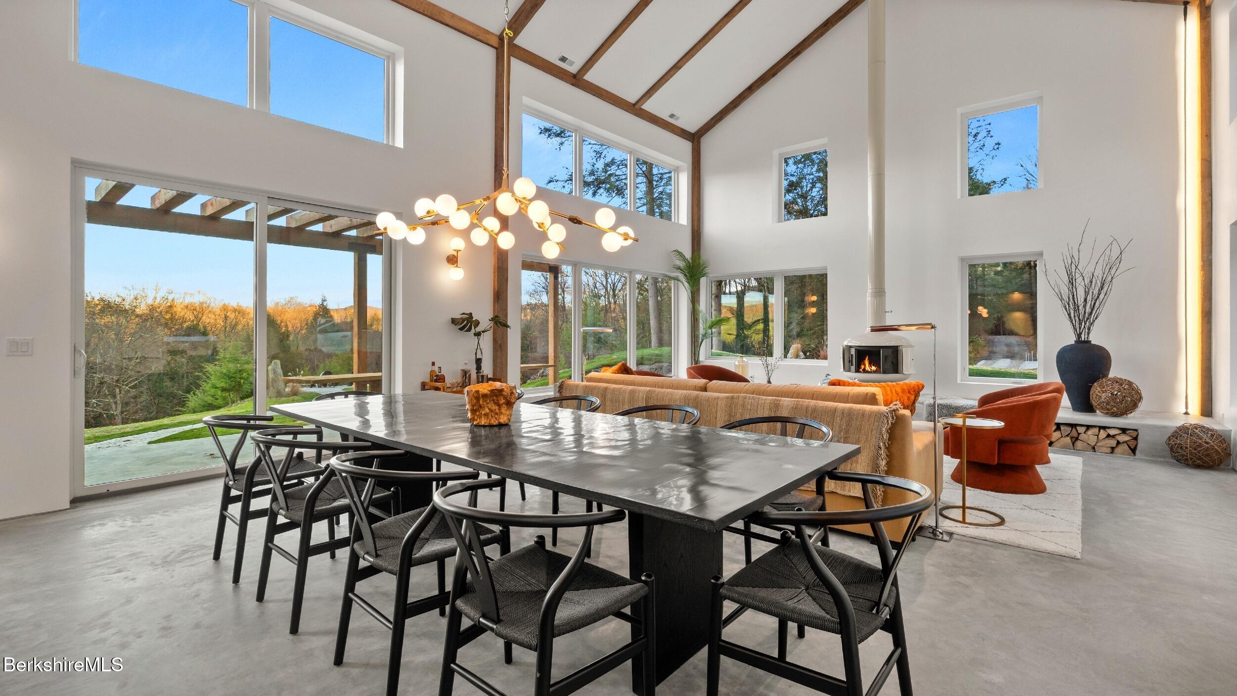 40 East Alford Road West Stockbridge, MA 01266 - Photo 9 of 51 a view of a dining room with furniture wooden floor and a large window
