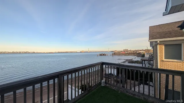 a view of city and mountain from a balcony