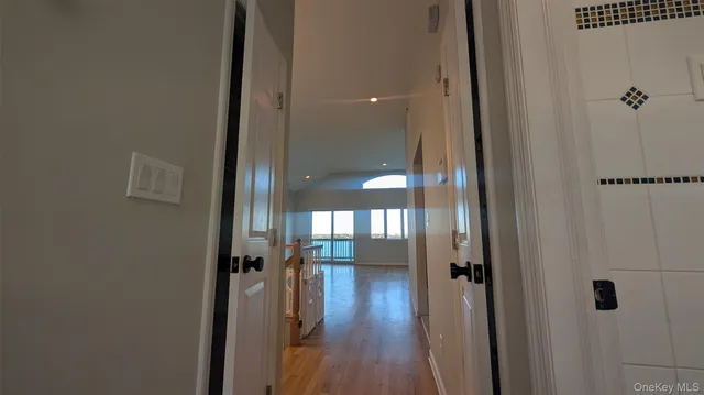 a view of gallery with wooden floor