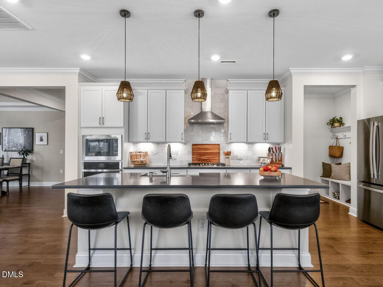 309 Toadstool Trail Wake Forest, NC 27587 - Photo 11 of 49 a kitchen with stainless steel appliances a dining table chairs and sink