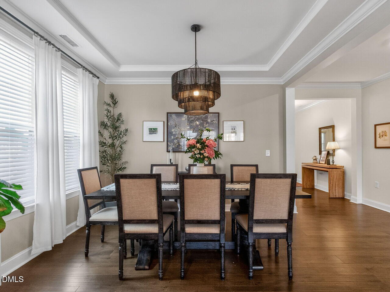 309 Toadstool Trail Wake Forest, NC 27587 - Photo 18 of 49 a dining room with furniture potted plants and wooden floor