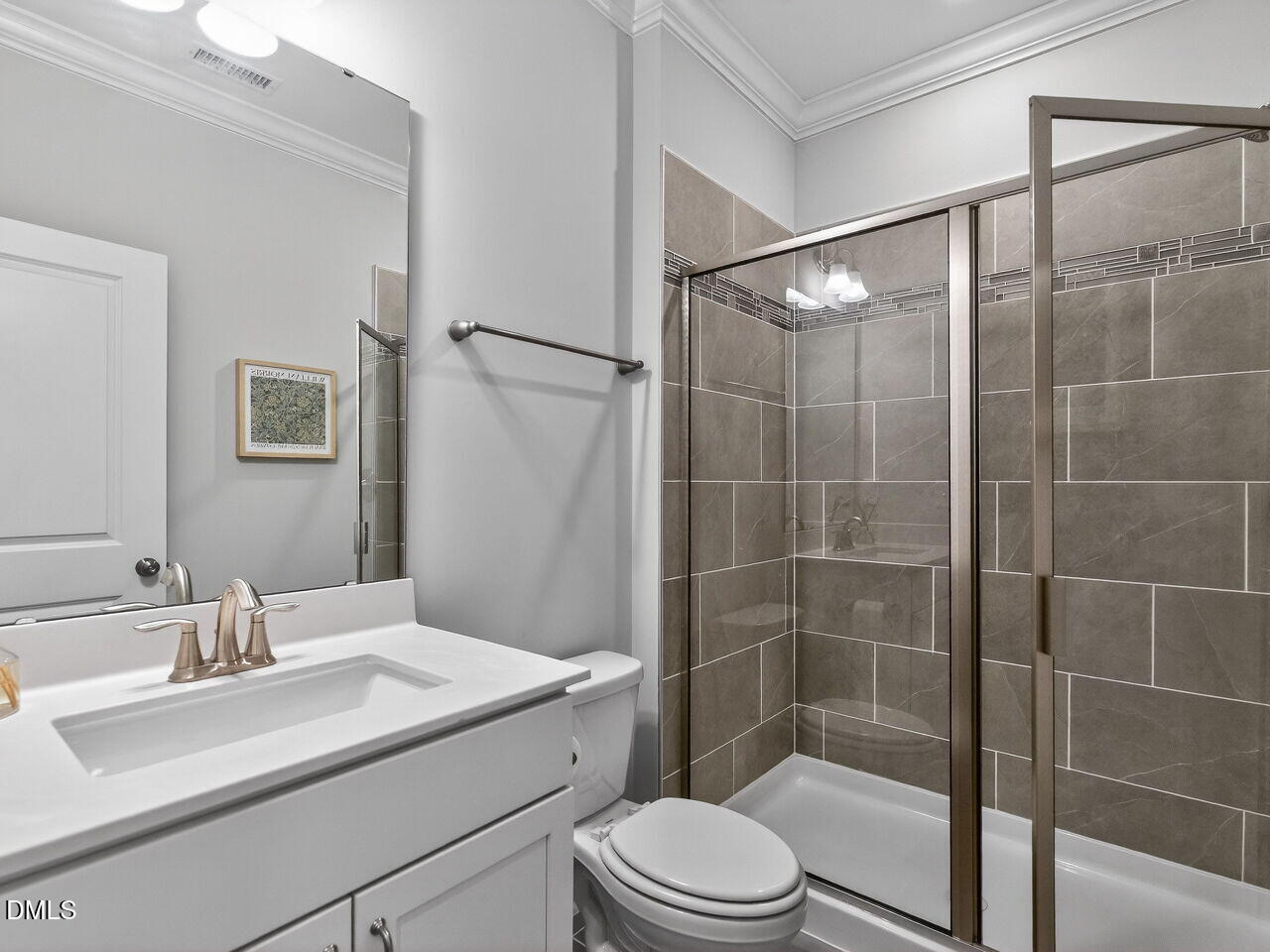 309 Toadstool Trail Wake Forest, NC 27587 - Photo 21 of 49 a bathroom with a sink a toilet and shower