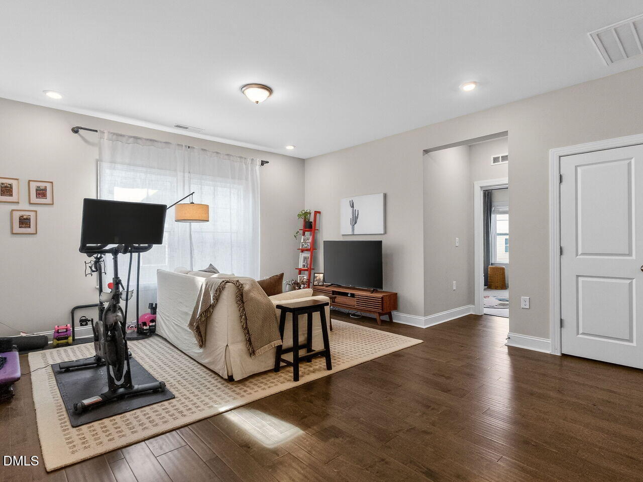 309 Toadstool Trail Wake Forest, NC 27587 - Photo 24 of 49 a living room with furniture and a flat screen tv
