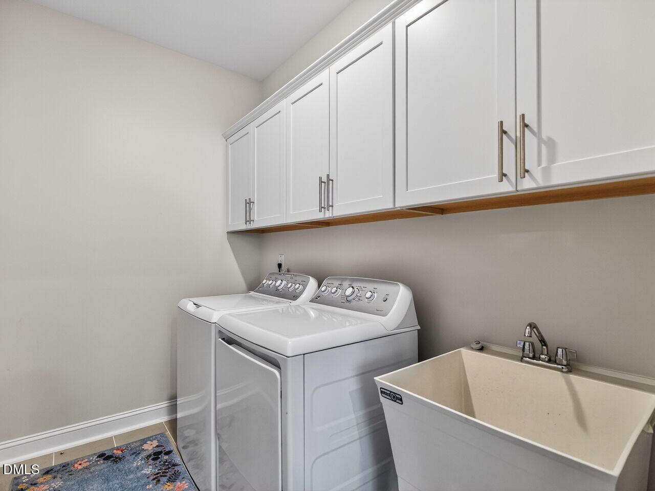 309 Toadstool Trail Wake Forest, NC 27587 - Photo 26 of 49 a utility room with dryer and washer