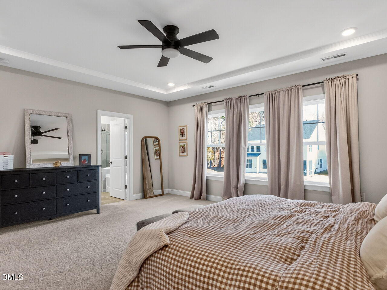 309 Toadstool Trail Wake Forest, NC 27587 - Photo 29 of 49 a bedroom with a bed closet and a large mirror
