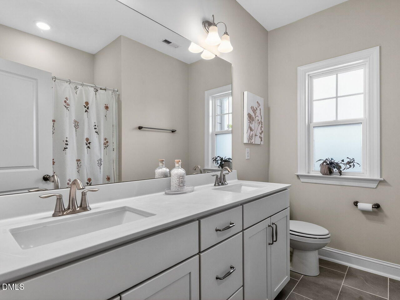 309 Toadstool Trail Wake Forest, NC 27587 - Photo 36 of 49 a bathroom with 2 sink toilet and a mirror