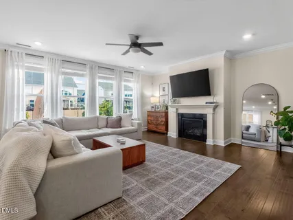 a living room with fireplace furniture and a flat screen tv