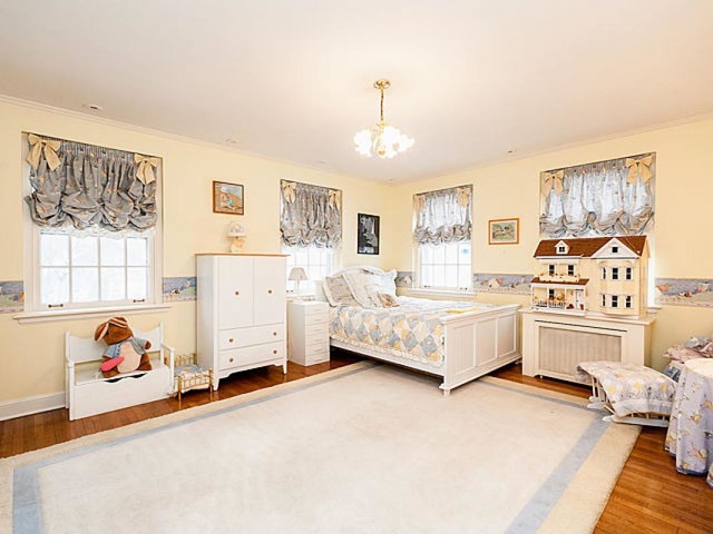 7600 Augusta Street River Forest, IL 60305 - Photo 13 of 25 a spacious bedroom with a bed and a cabinets