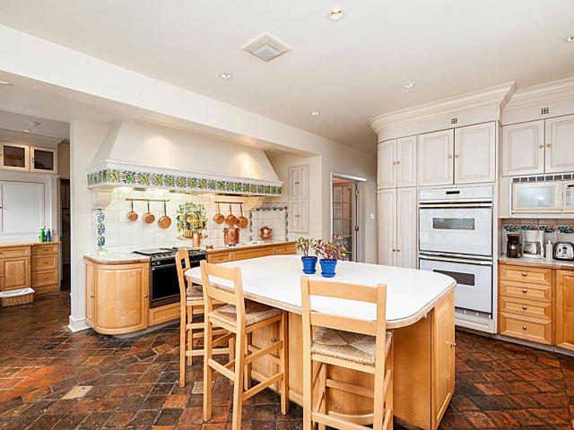 7600 Augusta Street River Forest, IL 60305 - Photo 8 of 25 a kitchen with stainless steel appliances kitchen island granite countertop a sink and cabinets