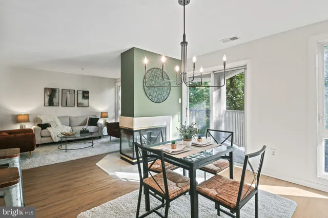 a view of a dining room with furniture window and wooden floor