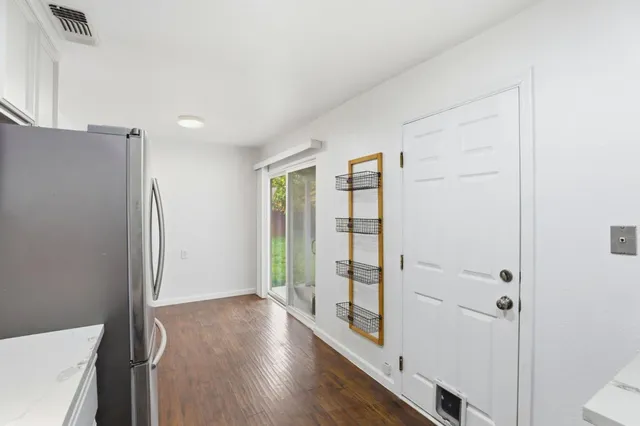 a view of entryway with wooden floor