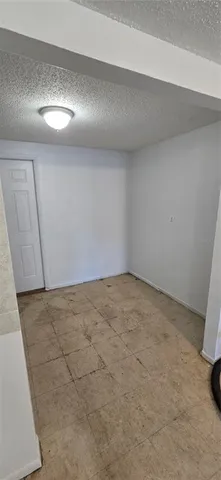 a view of a backyard with a tree