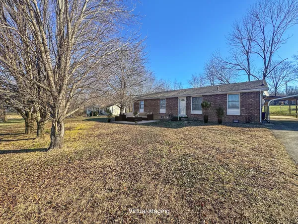 a bedroom with bed and wooden floor