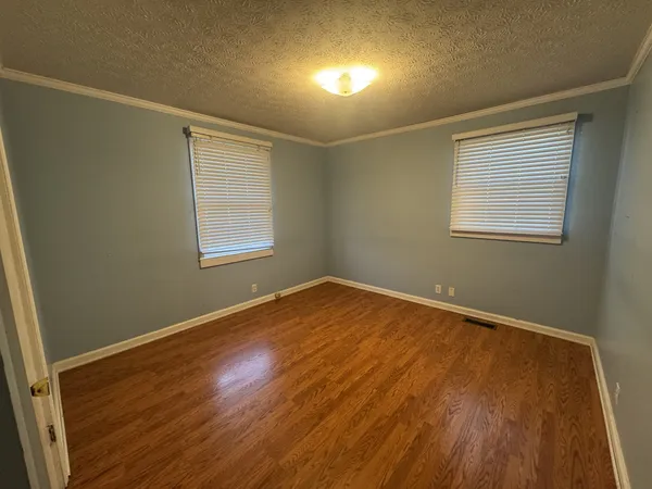 a storage room with wooden floor