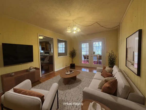 a view of a livingroom with furniture and windows