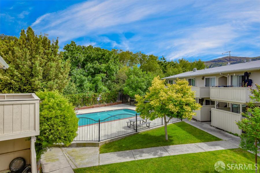 46728 Crawford Street, Unit 3 Fremont, CA 94539 - Photo 21 of 22 a view of a patio with table and chairs and potted plants