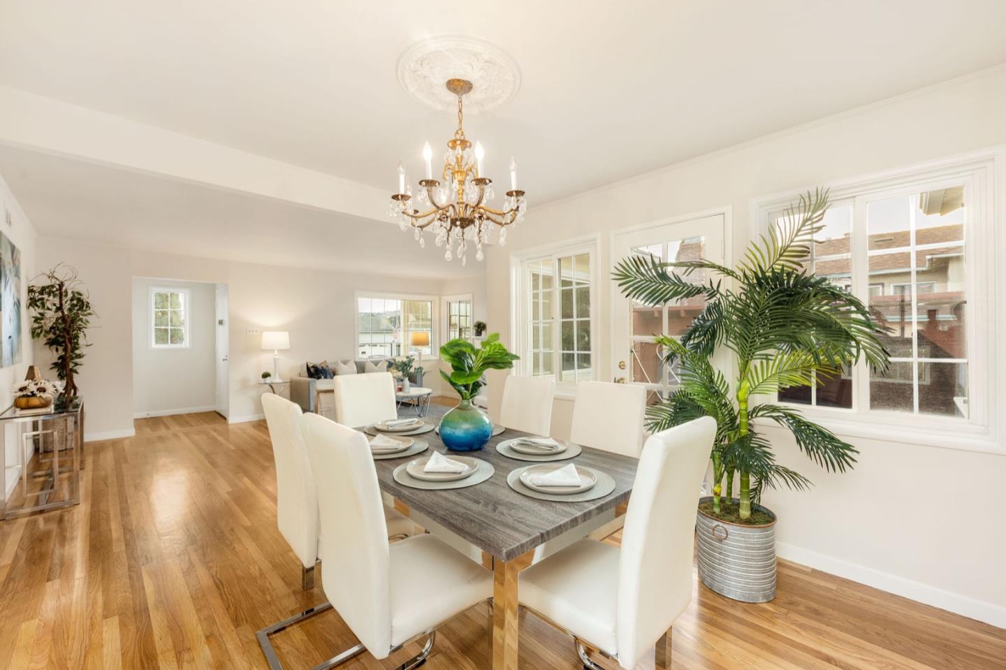 224 Helen Drive Millbrae, CA 94030 - Photo 14 of 42 a view of a dining room with furniture wooden floor and chandelier