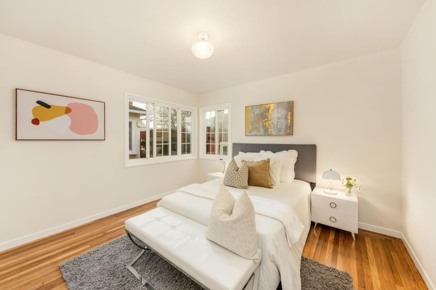 224 Helen Drive Millbrae, CA 94030 - Photo 17 of 42 a bed room with a bed and a painting on the wall