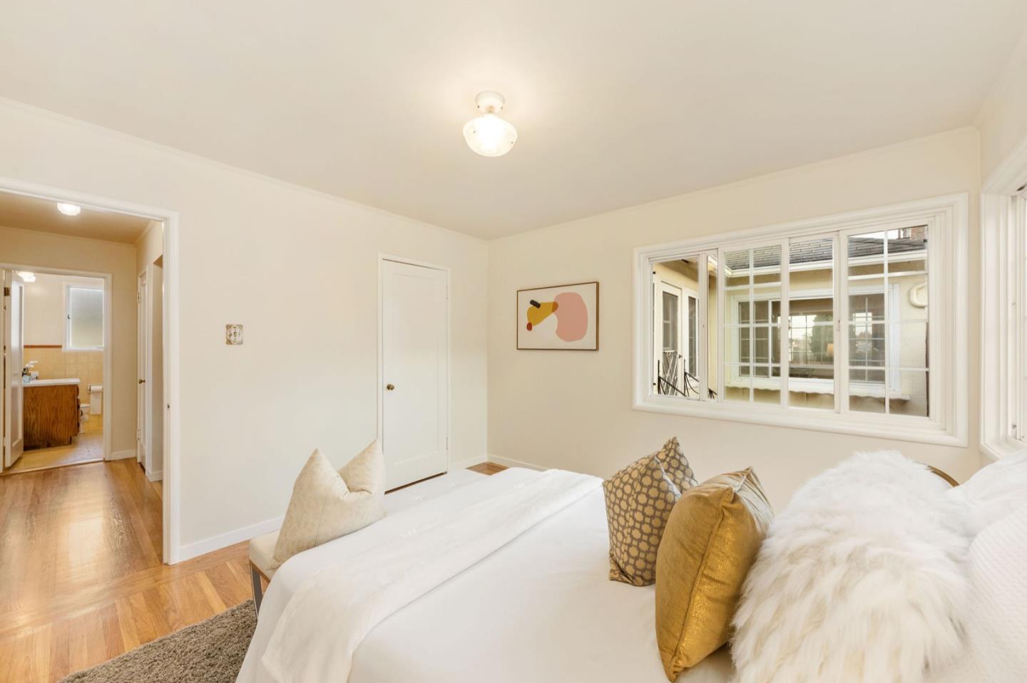 224 Helen Drive Millbrae, CA 94030 - Photo 18 of 42 a bedroom with a bed and wooden floor