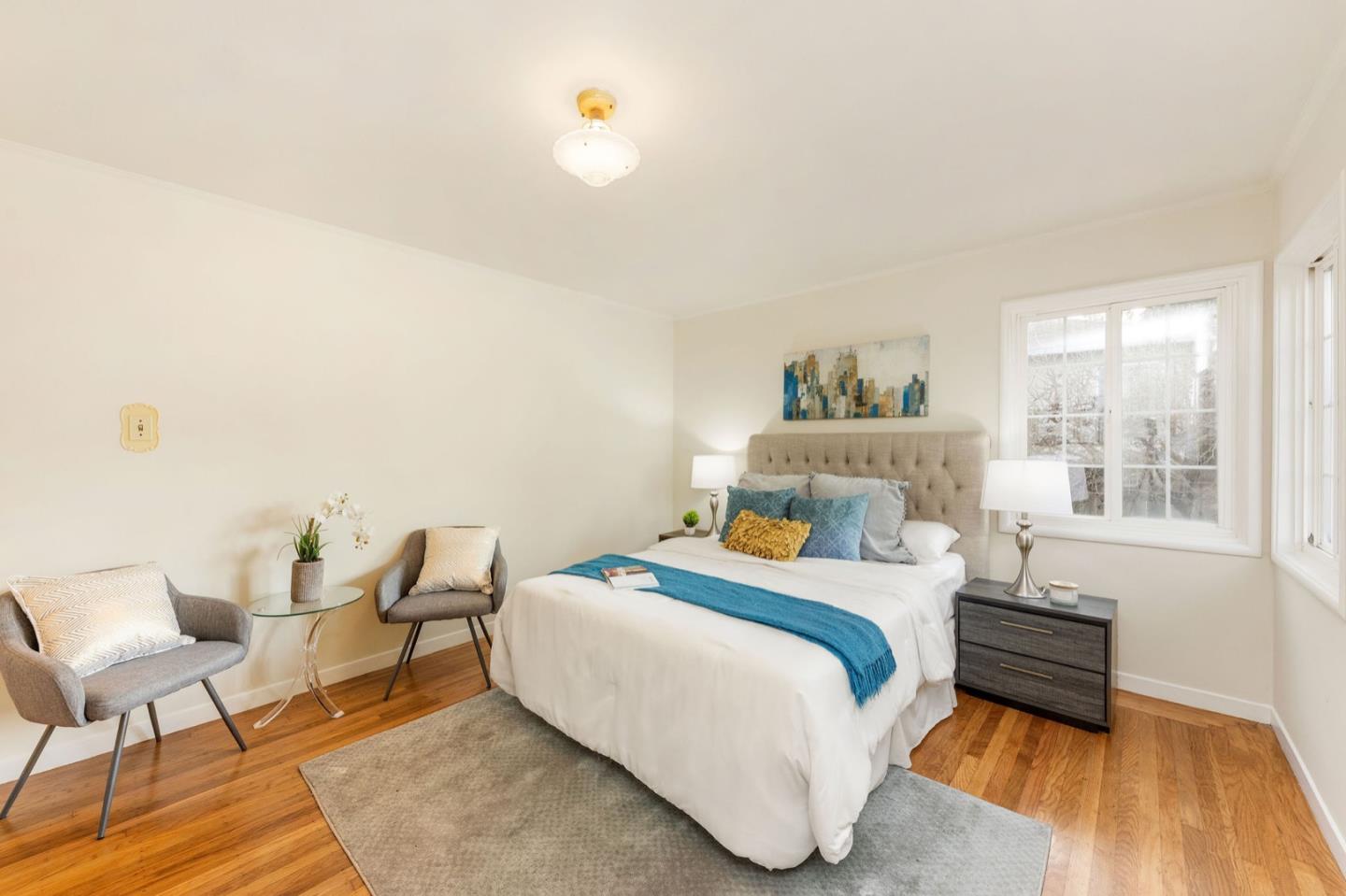 224 Helen Drive Millbrae, CA 94030 - Photo 20 of 42 a bedroom with a bed and wooden floor