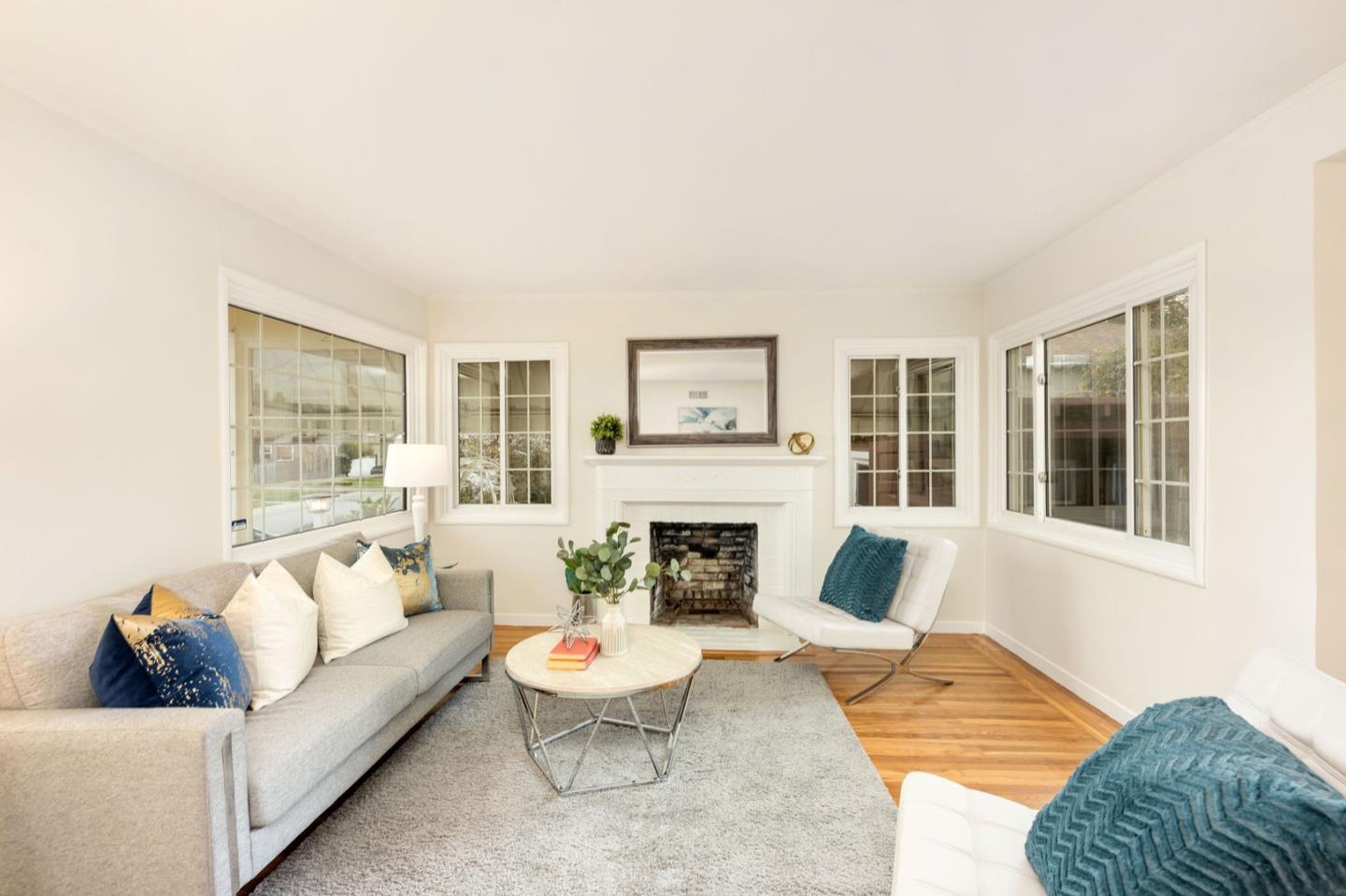 224 Helen Drive Millbrae, CA 94030 - Photo 10 of 42 a living room with furniture and a fireplace