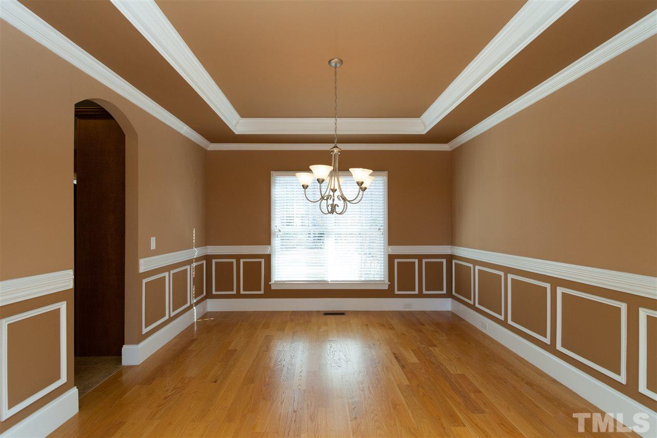 7217 Duncans Ridge Way Fuquay-Varina, NC 27526 - Photo 16 of 25 a view of an empty room with a window and wooden floor