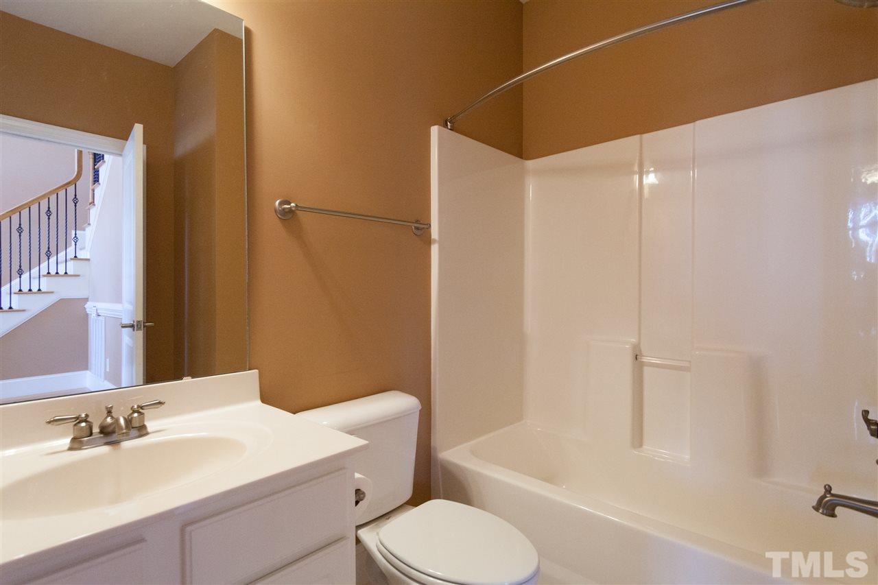 7217 Duncans Ridge Way Fuquay-Varina, NC 27526 - Photo 17 of 25 a bathroom with a sink toilet and shower