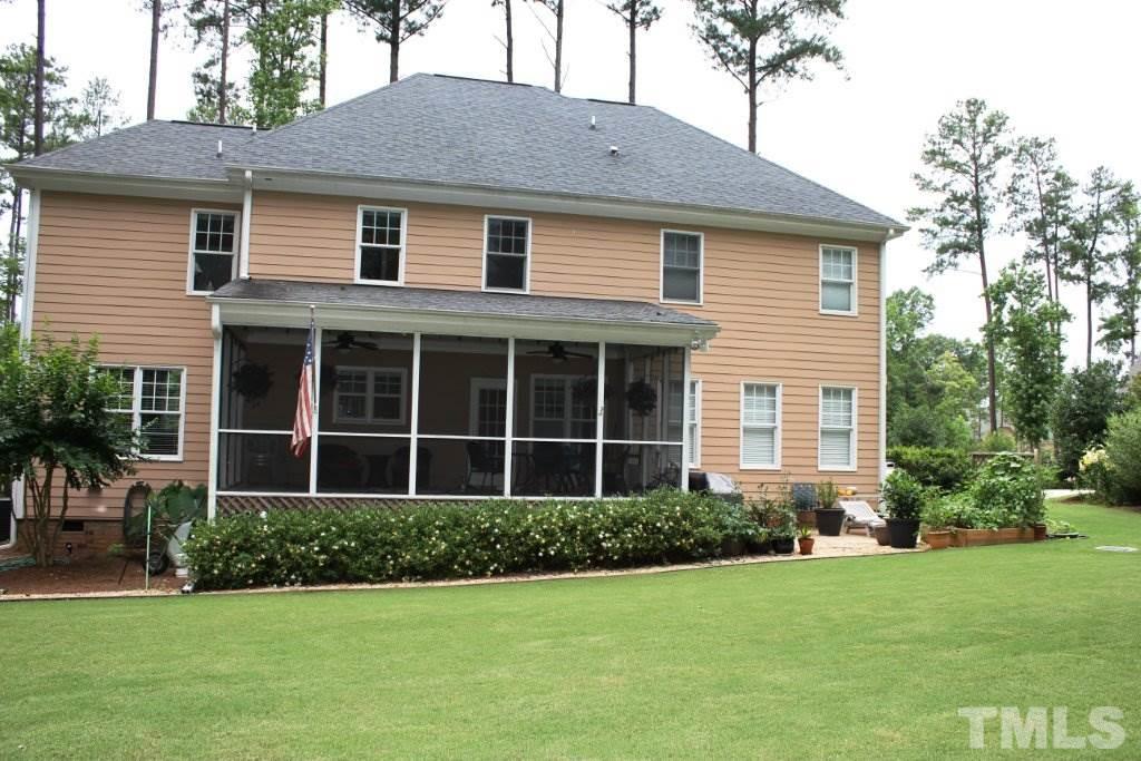 7217 Duncans Ridge Way Fuquay-Varina, NC 27526 - Photo 23 of 25 a front view of a house with a yard
