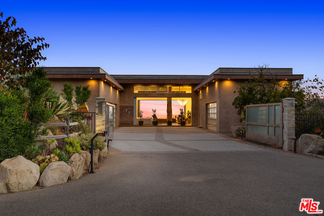 10715 Yerba Buena Road Malibu, CA 90265 - Photo 4 of 32 a view of a car park in front of a house