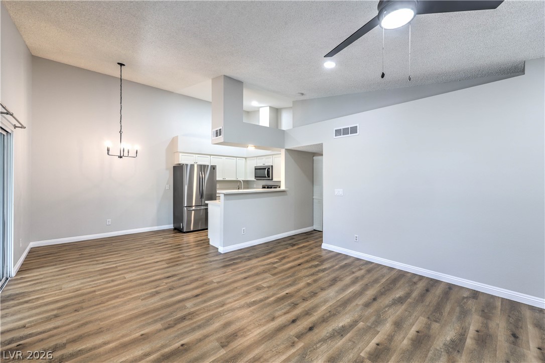 1575 West Warm Springs Road, Unit 322 Henderson, NV 89014 - Photo 8 of 25 This living space offers an open-concept design with stylish flooring and modern kitchen appliances.