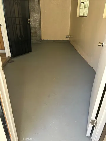 a view of a backyard with sitting area