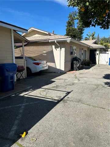 a view of a house with a parking space