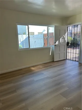 a view of an empty room with a window