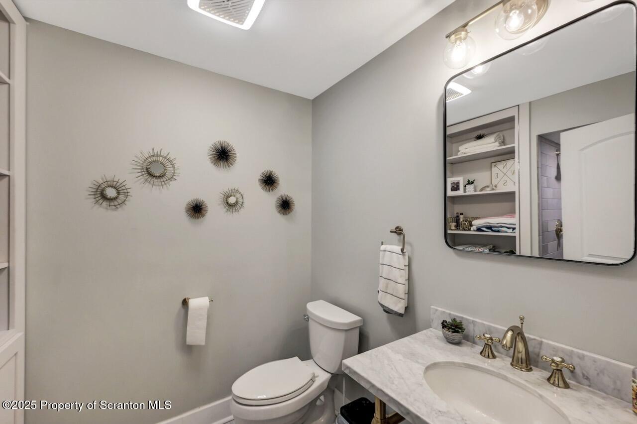 215 Fairview Road Clarks Green, PA 18411 - Photo 104 of 148 a bathroom with a sink a toilet and mirror