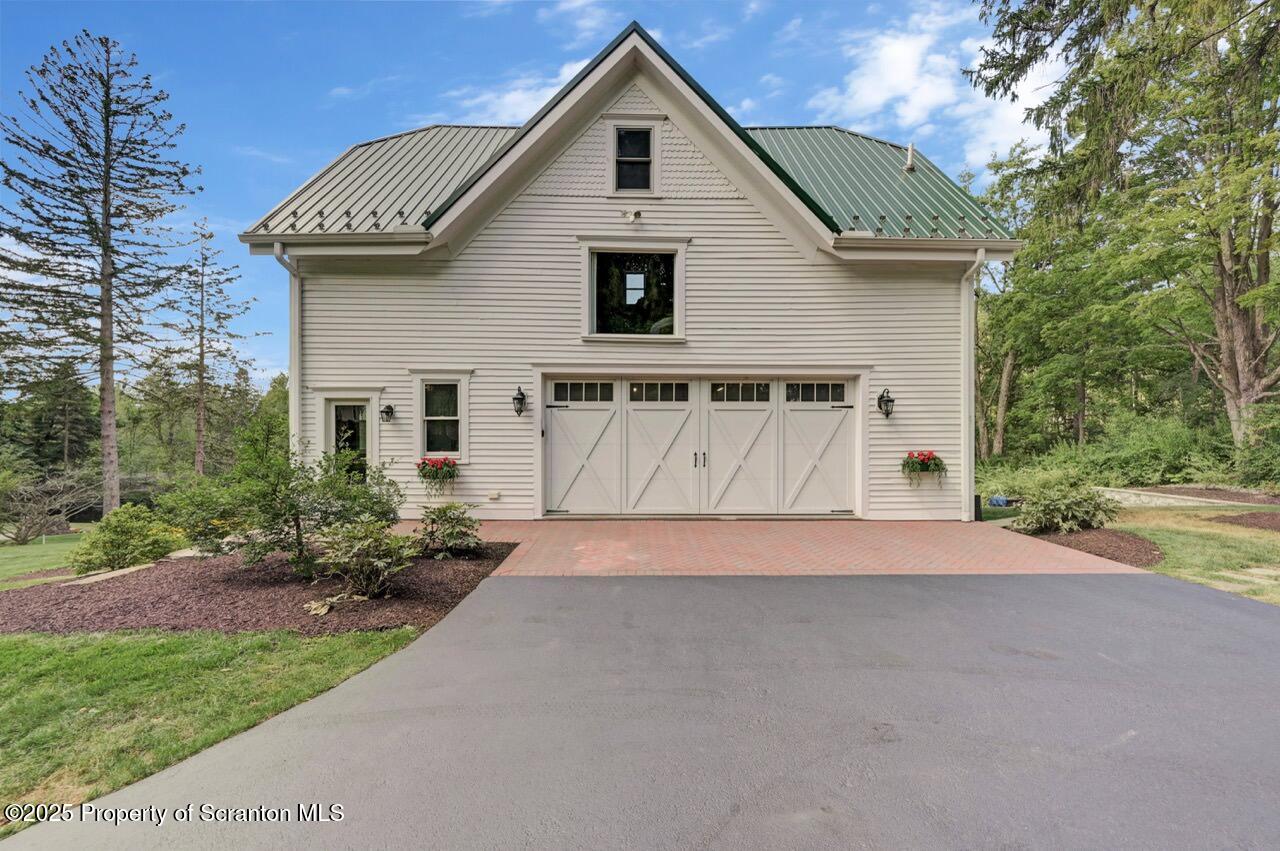 215 Fairview Road Clarks Green, PA 18411 - Photo 107 of 148 a front view of a house with a yard and garage