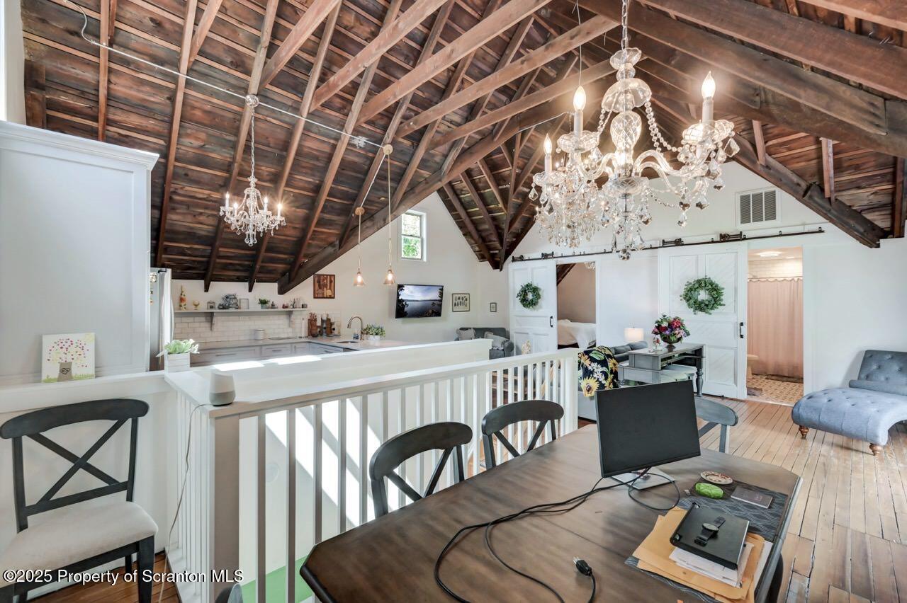 215 Fairview Road Clarks Green, PA 18411 - Photo 115 of 148 a view of a livingroom with furniture a flat screen tv and a table