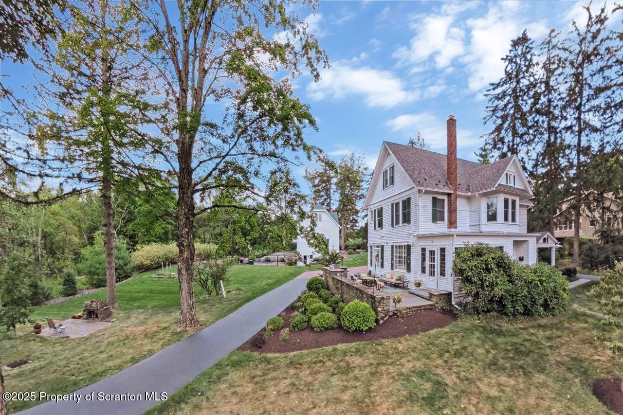 215 Fairview Road Clarks Green, PA 18411 - Photo 138 of 148 a front view of a house with a yard and potted plants