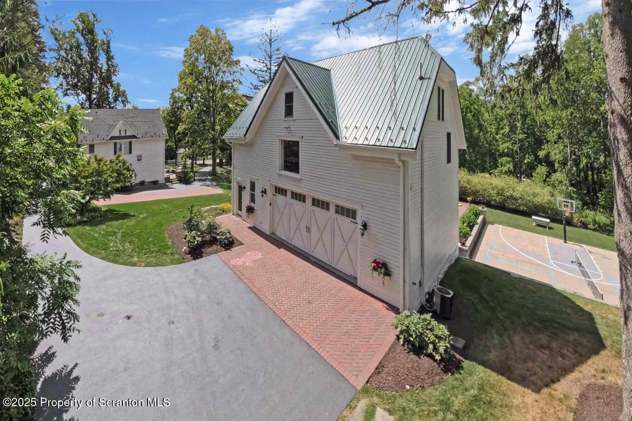 215 Fairview Road Clarks Green, PA 18411 - Photo 147 of 148 a view of a house with a small yard plants and a large tree