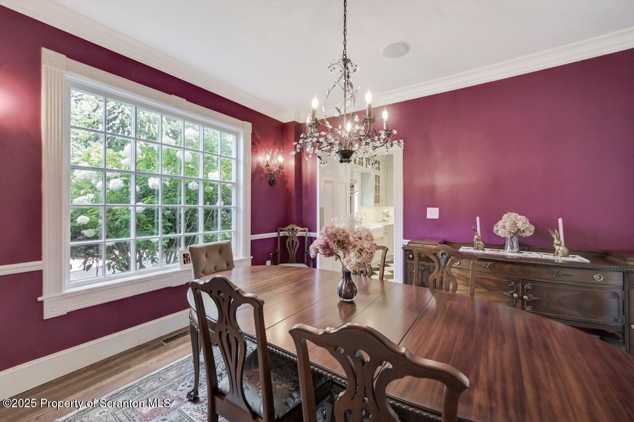 215 Fairview Road Clarks Green, PA 18411 - Photo 21 of 148 a view of a dining room with furniture a chandelier and wooden floor