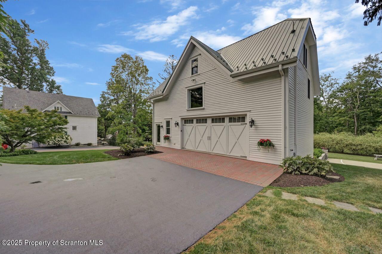 215 Fairview Road Clarks Green, PA 18411 - Photo 5 of 148 a view of backyard with potted plants and a large tree