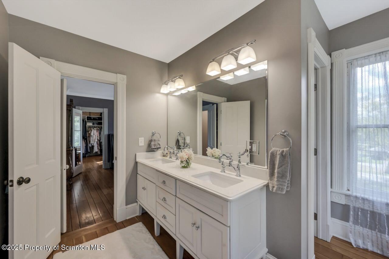 215 Fairview Road Clarks Green, PA 18411 - Photo 51 of 148 a bathroom with a double vanity sink and a mirror